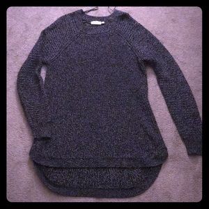 Long curved knit sweater